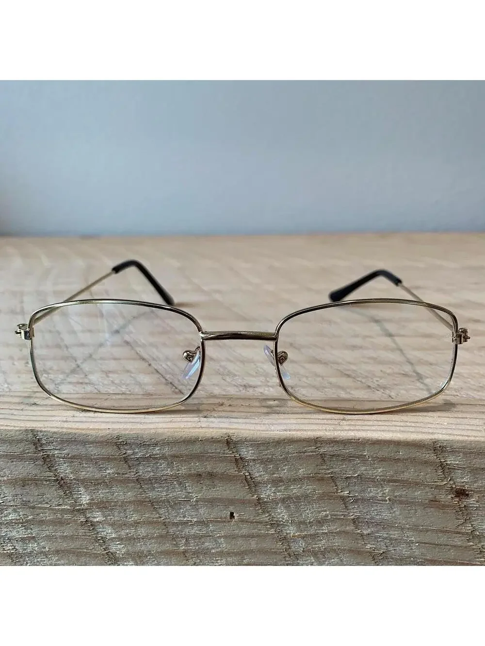 Y2k 90s 2000s vintage unique slim style lense sunglasses. gold trim with clear